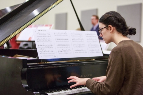 Student playing the piano