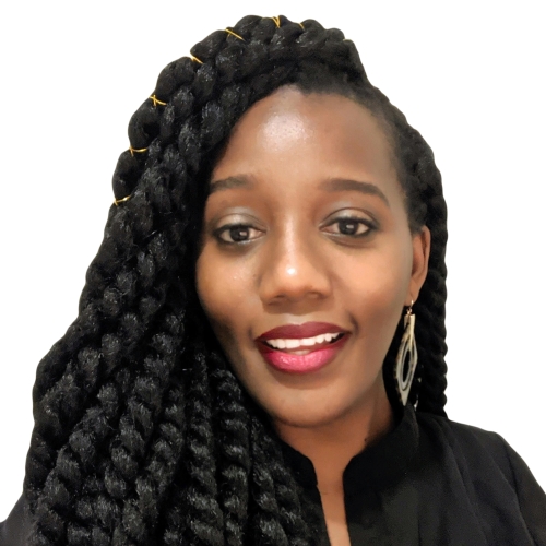 Portrait of a young woman wearing a black top. Her hair is in long two-strand twists with decorative gold accents.
