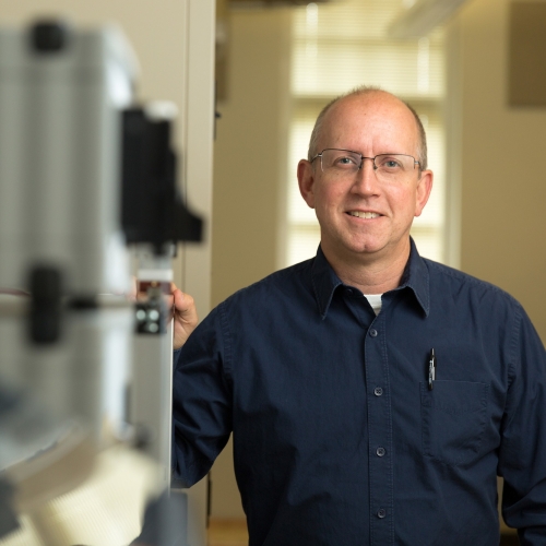 Professor standing in engineering lab